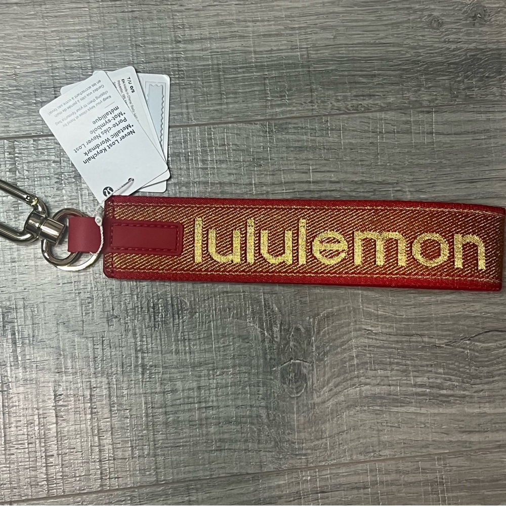 NWT Lululemon Red and Gold Keychain